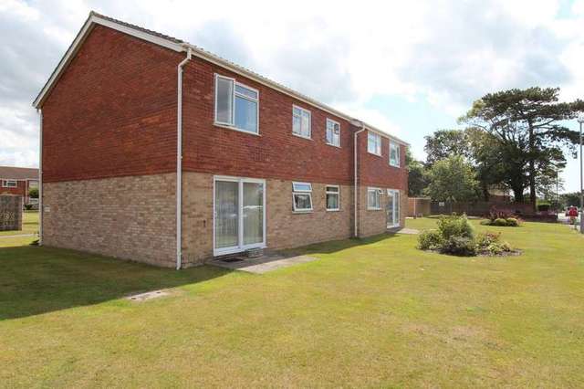  Image of 2 bedroom Ground Flat for sale in The Lawns Waterford Road Highcliffe Christchurch BH23 at Highcliffe Christchurch Dorset, BH23 5LF