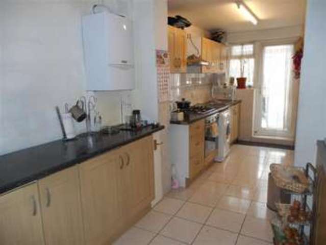  Image of 3 bedroom Terraced house for sale in Ravensbourne Gardens Ilford IG5 at Clayhall Essex Ilford, IG5 0XH